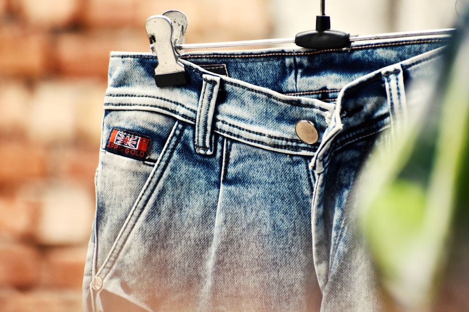 Fashionable blue denim jeans on display, perfect for casual wear.