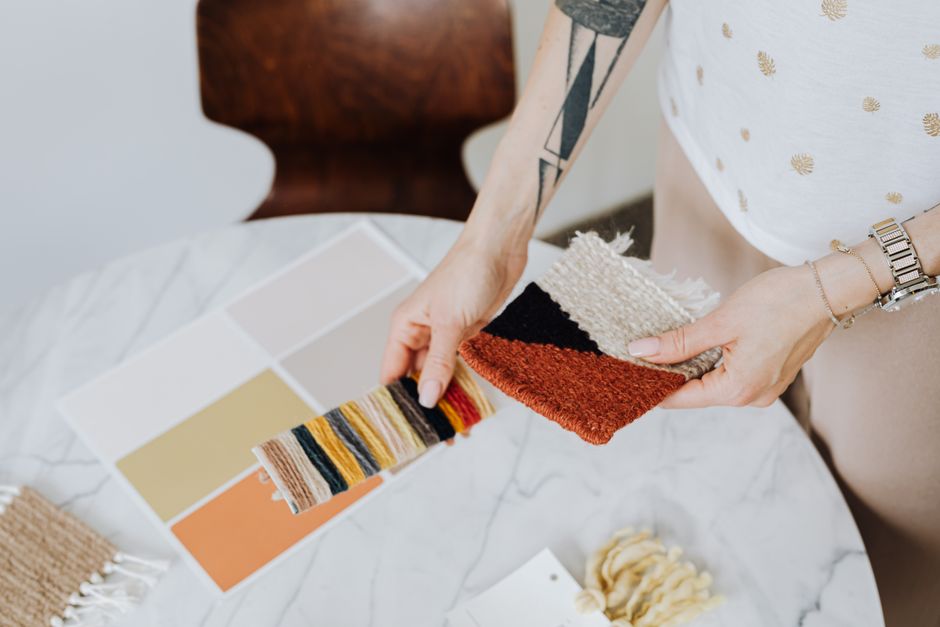 Close-up of fabric samples with color swatches for interior design.