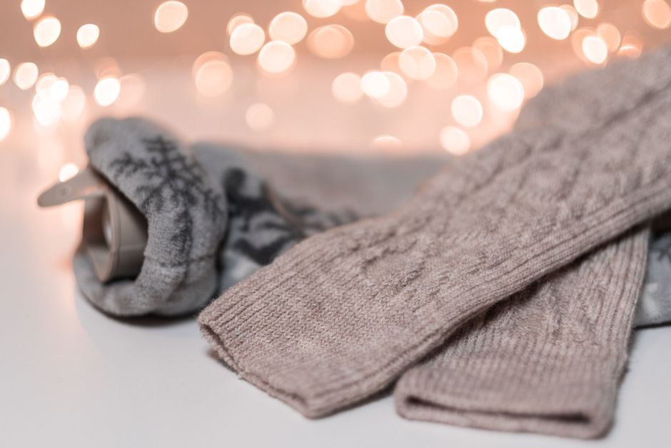 Soft knitted socks with a warm glow background, ideal for winter coziness.
